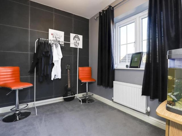 The fourth bedroom is the smallest in the Sutton house. But it is still a decent size, with a carpeted floor, wall-mounted radiator and uPVC double-glazed window to the back.