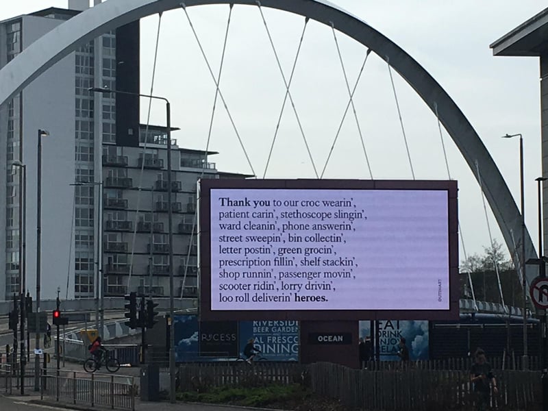 An electronic billboard on the River Clyde uses verse to thank key workers.