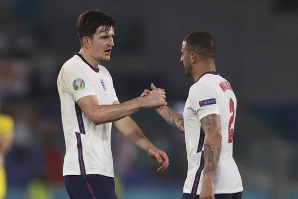 Sheffeld pair Harry Maguire and Kyle Walker congratulate each other after England's Euro 2020 quarter-final victory over Ukraine in Rome on Saturday night. (Lars Baron/Pool Photo via AP)