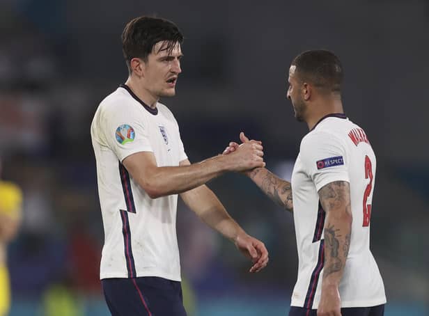 Sheffeld pair Harry Maguire and Kyle Walker congratulate each other after England's Euro 2020 quarter-final victory over Ukraine in Rome on Saturday night. (Lars Baron/Pool Photo via AP)