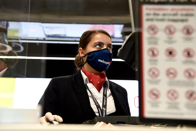 Staff wearing protective face coverings will become a familiar sight at Edinburgh Airport.