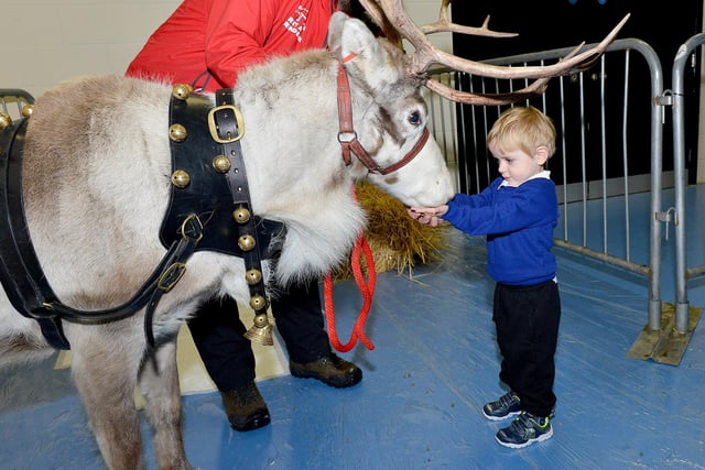 Jack Mason-Huntley says hello to Troy the reindeer in 2017.