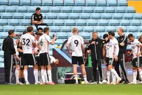 Chris Wilder, Manager of Sheffield United gives his team instructions during a drinks break during the Premier League match between Aston Villa and Sheffield United at Villa Park on June 17, 2020 in Birmingham, England. (Photo by Paul Ellis/Pool via Getty Images)