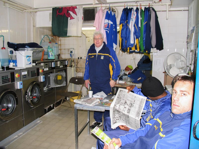 Barry Harris and former goalkeeper Sander Westerveld hang out in the laundry room at Fratton Park. Picture: Habibur Rahman