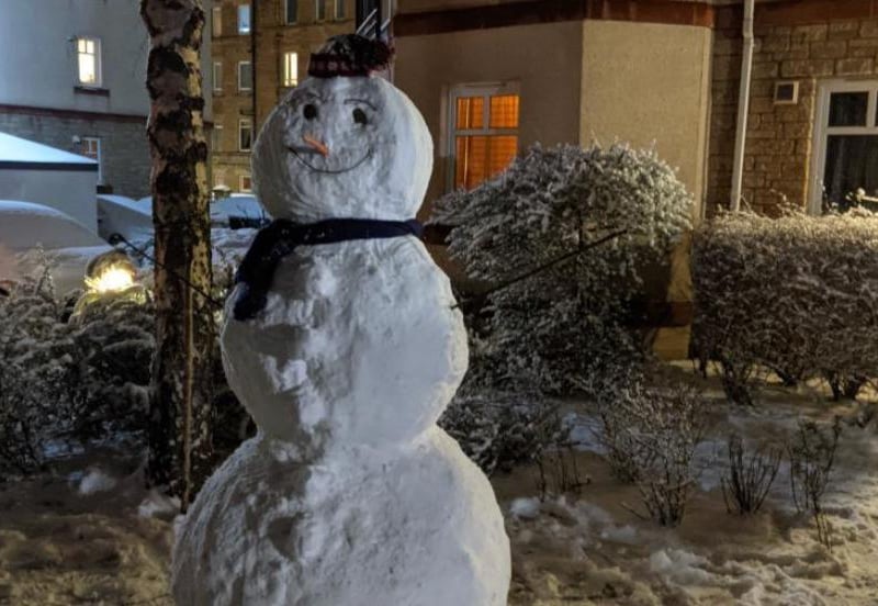 This friendly snowman was snapped last night in Gorgie, Edinburgh, as the snow continued to fall.