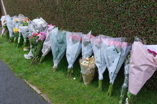Devastated friends left flowers outside Bryan and Mary Andrews' home at the time of their death.