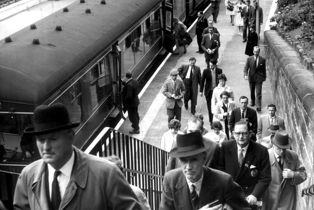 Travellers disembark at Edinburgh's Morningside railway station in 1961 - the station, which opened in 1884, was closed down in 1962 although the line remains and is used for freight