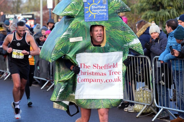 A Christmas tree competes in the Percy Pud 2019 race in Sheffield's Loxley Valley
