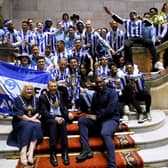 Sheffield Wednesday manager Darren Moore and his team celebrate their promotion to the Sky Bet Championship at Sheffield Town Hall following an open top bus parade. Sheffield Wednesday secured their promotion to the Championship after Josh Windass scored in injury time at the end of extra-time of the play-off final. Picture date: Wednesday May 31, 2023. PA Photo. See PA story SOCCER Sheff Wed. Photo credit should read: Richard Sellers/PA Wire.

RESTRICTIONS: Use subject to restrictions. Editorial use only, no commercial use without prior consent from rights holder.