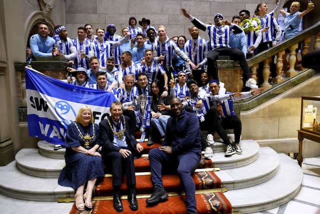 Sheffield Wednesday manager Darren Moore and his team celebrate their promotion to the Sky Bet Championship at Sheffield Town Hall following an open top bus parade. Sheffield Wednesday secured their promotion to the Championship after Josh Windass scored in injury time at the end of extra-time of the play-off final. Picture date: Wednesday May 31, 2023. PA Photo. See PA story SOCCER Sheff Wed. Photo credit should read: Richard Sellers/PA Wire.

RESTRICTIONS: Use subject to restrictions. Editorial use only, no commercial use without prior consent from rights holder.