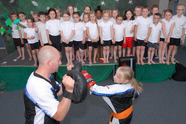 Millie Yates was watched by pupils from Sutton's Dalestorth Primary School as she demonstrated her sport of Kick Boxing with her step father Brian Slaney in 2013