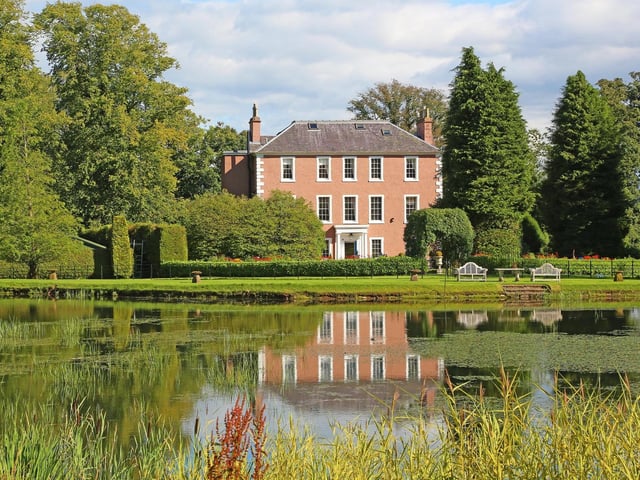 The 70-acre property includes extensive private woodlands and its own loch