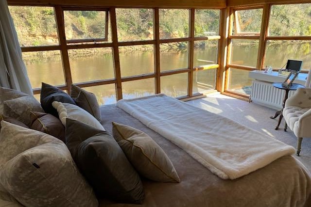 Floor to ceiling windows in the master bedroom with unrivalled views of the River Coquet.