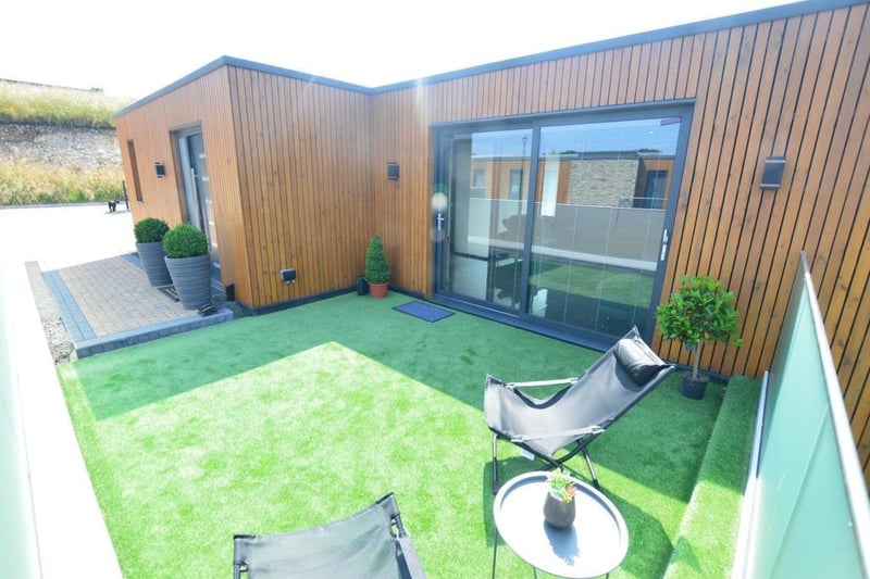 The roof terrace can be accessed via full-length sliding doors from the lounge.