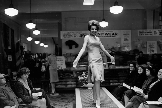 A model takes to the catwalk at a mannequin parade and fashion show at JR Allan's, on North Bridge, in March 1962.