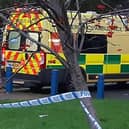 A woman pedestrian is critically ill after a collision with a car near the bend in the road near Greenacre School, Barnsley. File picture shows an ambulance and police tape.