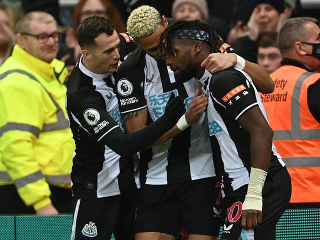 Newcastle United's French midfielder Allan Saint-Maximin (R) celebrates with teammates after scoring the opening goal of the English Premier League football match between Newcastle United and Manchester United at St James' Park(Photo by Paul ELLIS / AFP)
