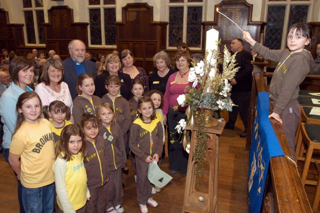 In 2007 Abbie Kingswood, right, a member of St Augustines Brownies lit the Shine Tree of Lights Candle at the ceremony held at Queen Elizabeths School