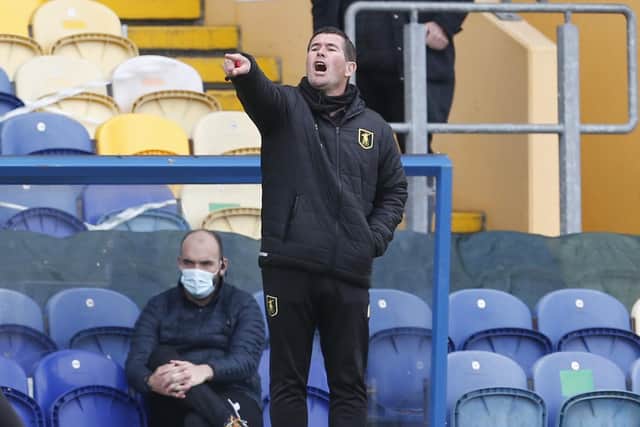 Mansfield Town Manager Nigel Clough is backing his old club Derby County to win the three-way battle to avoid relegation from the Championship on Saturday