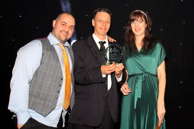 Julia Rodgerson, Derbyshire Times Deputy Editor, presents the Employee of the Year award  to Damion Davies, of O'Connor and Co Removals Ltd,  with Sean O'Connor.