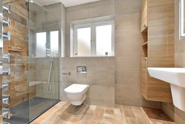 This is the master bedroom's en-suite - its key feature is a large walk-in shower enclosure with a fitted Abode rain head shower.