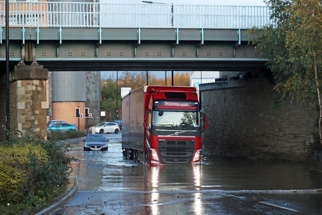 A lorry drives through floodwater near Meadowhall shopping centre in Sheffield.