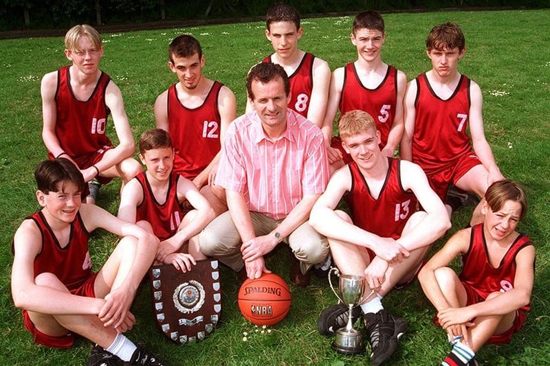 At Handsworth Grange School, Handsworth Grange Road, Sheffield, where the school's U15 Basketball League winning team is seen. Left to right, back row are, Daniel Green, Chris Slack, Gareth Rees, Stephen Prior, and Daniel Howden. Front row: Andrew Turner, Steven Stacey, Mr Dermot McDaid, Nick Savage, and Jamie Randle, June 1996