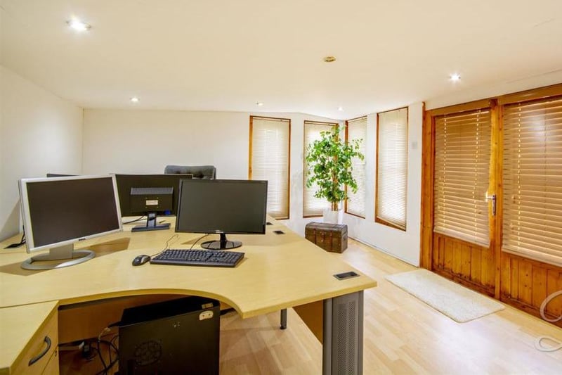 The annexe even has its own office. It has laminate flooring, windows and patio doors leading outside.