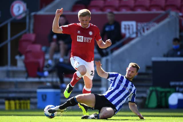 Taylor Moore of Bristol City is challenged by Tom Lees of Sheffield Wednesday. (Photo by Stu Forster/Getty Images)