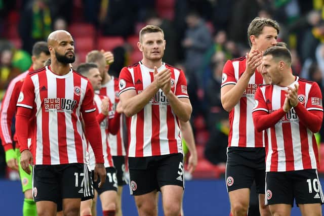 Sheffield United's David McGoldrick, Jack O'Connell and Billy Sharp (left to right) celebrate their victory after the final whistle during the Premier League match at Bramall Lane, Sheffield. PA Photo. Picture date: Saturday March 7, 2020. See PA story SOCCER Sheff Utd. Photo credit should read: Anthony Devlin/PA Wire.