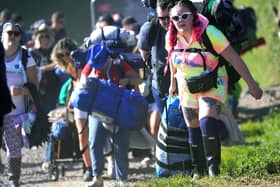 People arrive on the first day of the Glastonbury Festival at Worthy Farm in Somerset. Photo: Yui Mok/PA Wire