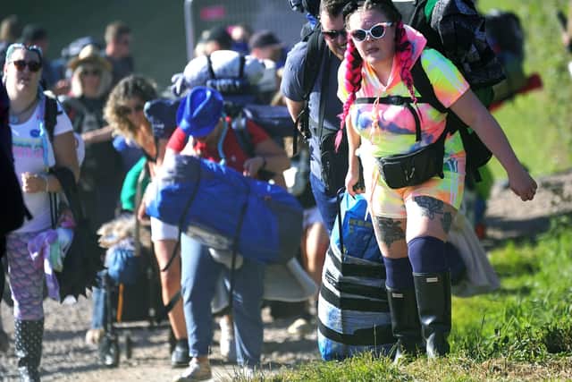 People arrive on the first day of the Glastonbury Festival at Worthy Farm in Somerset. Photo: Yui Mok/PA Wire
