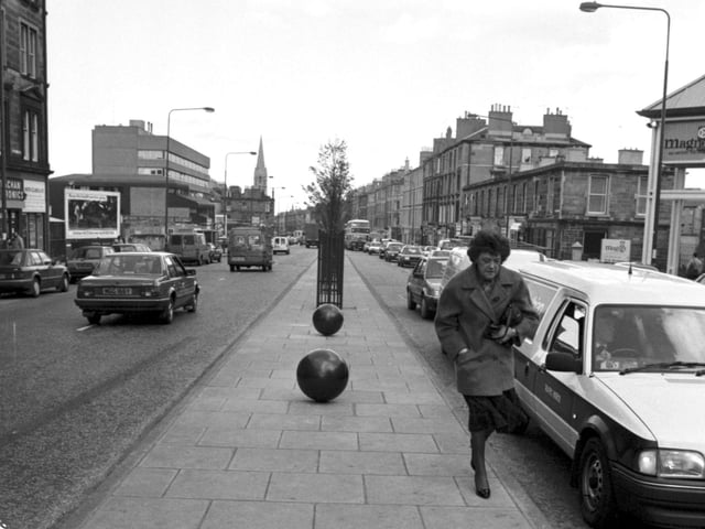 Community art - large balls painted black were set into the central reservation in Edinburgh's Leith Walk, April 1990.