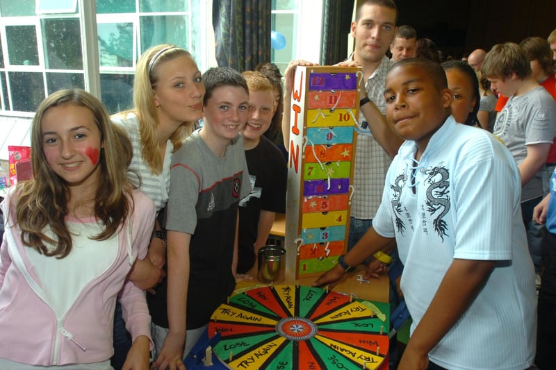Pupils with the Wheel of Fortune game at thr summer fair held at All Saints RC Secondary school, Granville Road, Sheffield