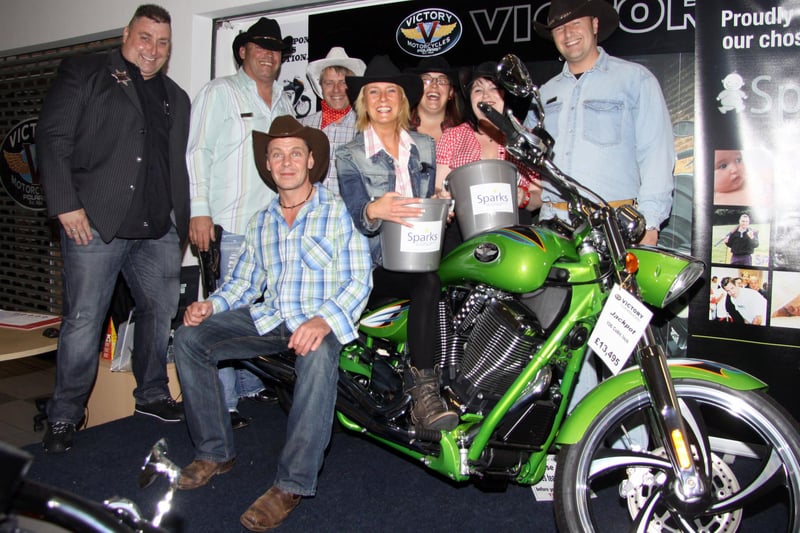 Workers at Stratstone, Clay Cross, hold a  Wild West fun day in aid of charity in 2010.
