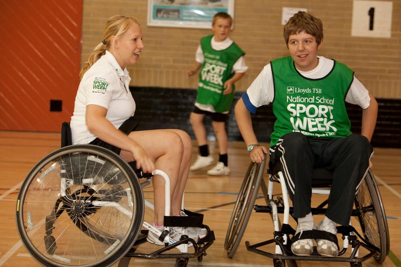 Olympic silver medallist, badminton player Gail Emms, tries her hand at wheelchair basketball during the Forge School Sport Partnership's celebration of Lloyds TSB National School Sport Week at Concord Leisure Centre Gail is pictured with Tom Allmark, 15, from King Ecgbert School