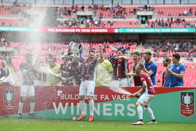 South Shields players celebrate winning the FA Vase trophy after the Buildbase FA Vase Final between South Shields and Cleethorpes Town at Wembley Stadium.