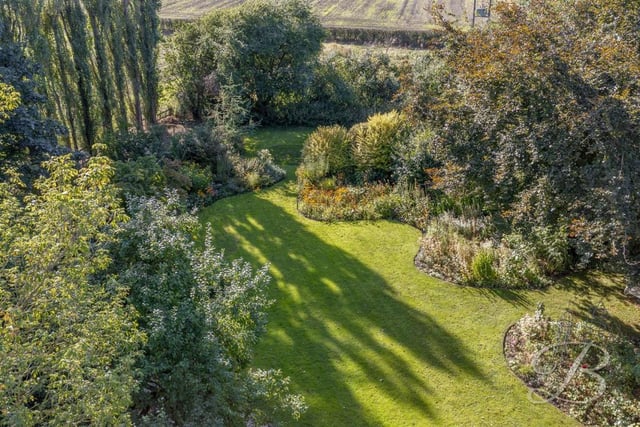 This photo gives you an idea of the glorious, well-maintained garden at the back of the house. It looks great all year round.