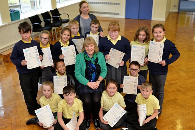 Sue Garrington (sitting) photographed with Golden Flatts teacher Sarah Barton and Year 4 pupils with their Arts Award certificates. Remember this from 2009?