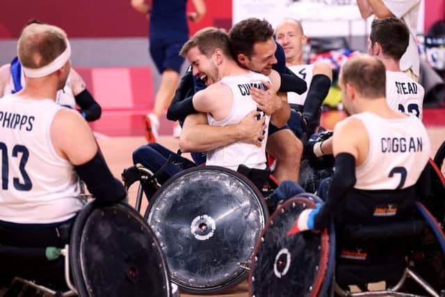Britain's players celebrate their victory in the wheelchair rugby gold medal match between Britain and the US during the Tokyo 2020 Paralympic Games at the Yoyogi National Stadium in Tokyo on August 29, 2021. (Photo by Behrouz MEHRI / AFP) (Photo by BEHROUZ MEHRI/AFP via Getty Images)