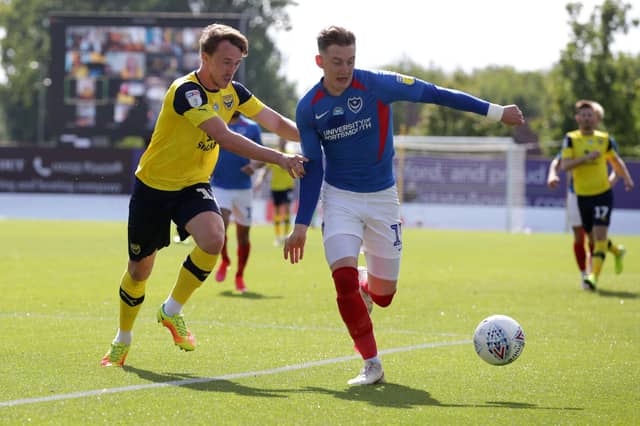 Ronan Curtis breaks free of Oxford's Sam Long during the first half