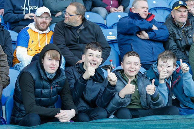 Mansfield Town fans watch their team win at home against Scunthorpe Utd.