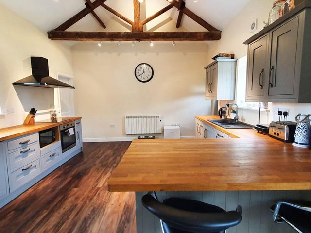 The Barn has a "lovely" oak beamed kitchen with diner area.