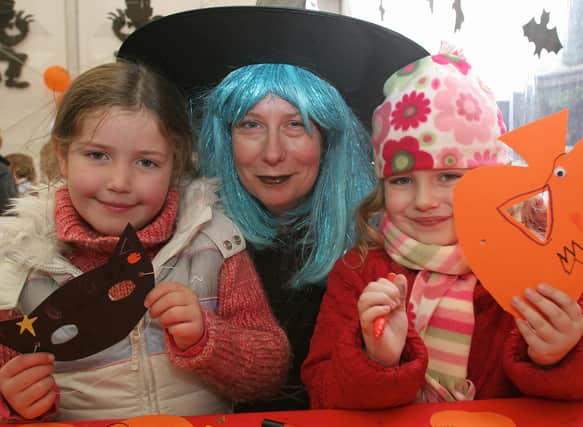 Chatsworth halloween activities in the farmyard, Cheryl Burfield with six year olds Stella Nicholson and Madeline Hendry