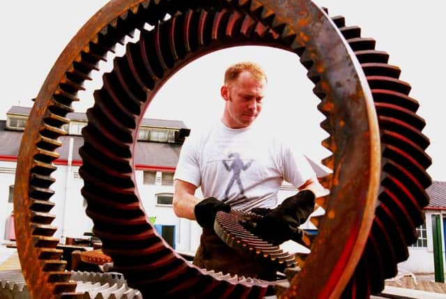 Micheal Bunn at work on his sculpture which was based at Carr Hill in 1996.