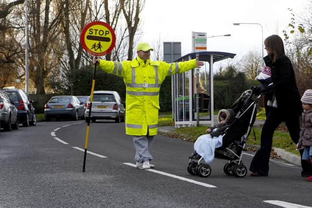 Sheffield has more than 50 crossing wardens, helping chidren safely across roads