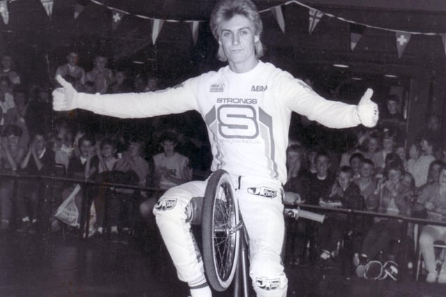 BMX cycle world wheelie champion Craig Strong, whose record for riding a cycle on one wheel then stood at 2 hours 58 minutes, showing his technique to the youngsters who attended the BMX Super Bike Show at the Top Rank Suite. Sheffield in June 1984