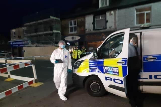 Police scene of crime officers on the scene at a reported stabbing in Crookes, Sheffield. Police have now confirmed they are investigating the murder of a teenager
STAR