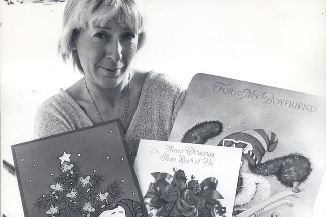 Christine Ward of Dore, who is the Hallmark Merchandiser for Sheffield pictured with some of the new lines of giant Christmas cards in 1984