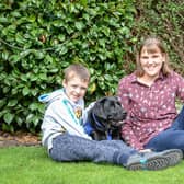 Sam and his mum Emma with support dog Willow